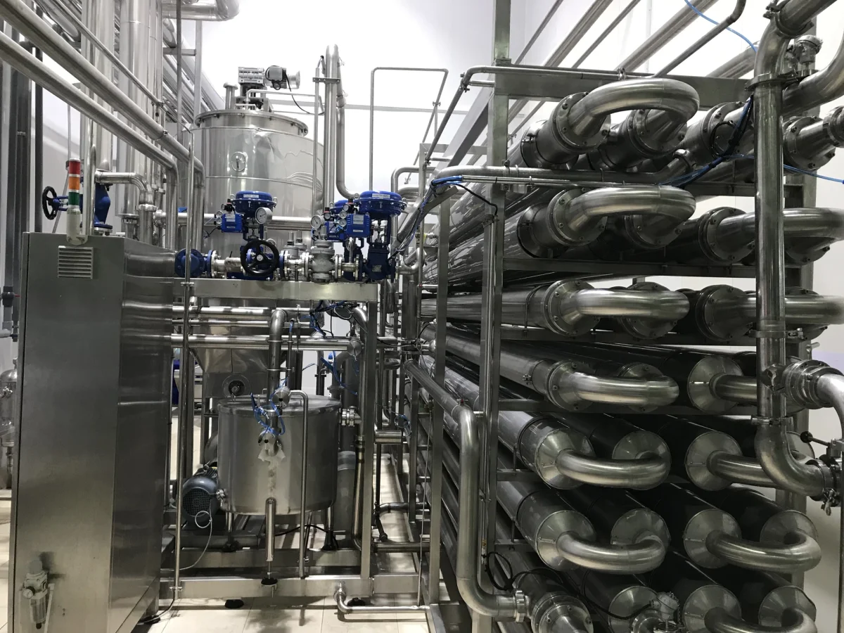 UHT Systems: UHT return bends and process piping viewed close-up.