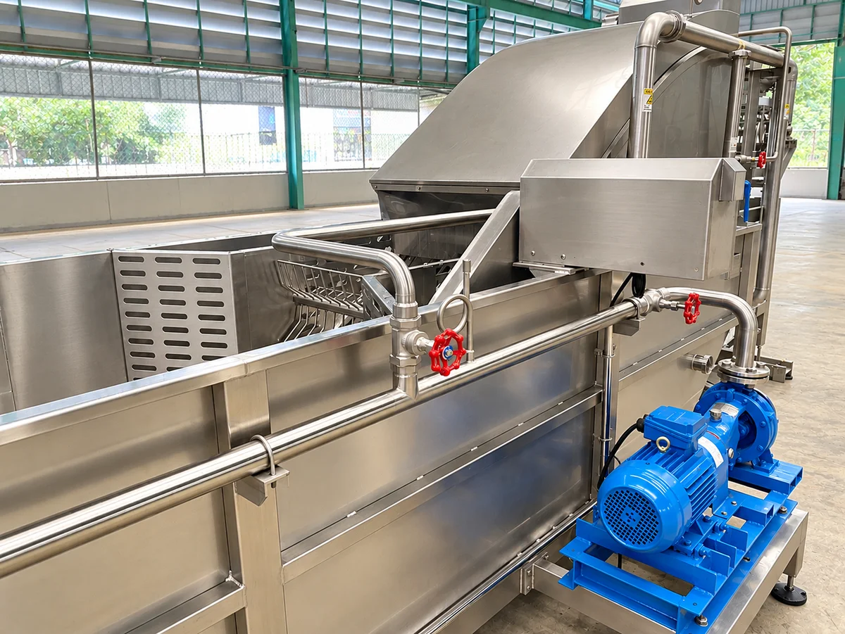 Stainless-steel washing bath and cover with pipework, valves and a blue blower beside the frame.