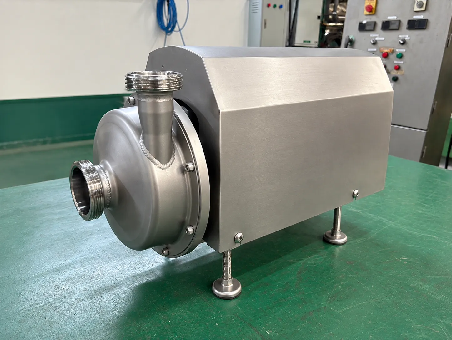 FCM Pump: FCM pump inlet, outlet and drive cover from the side.