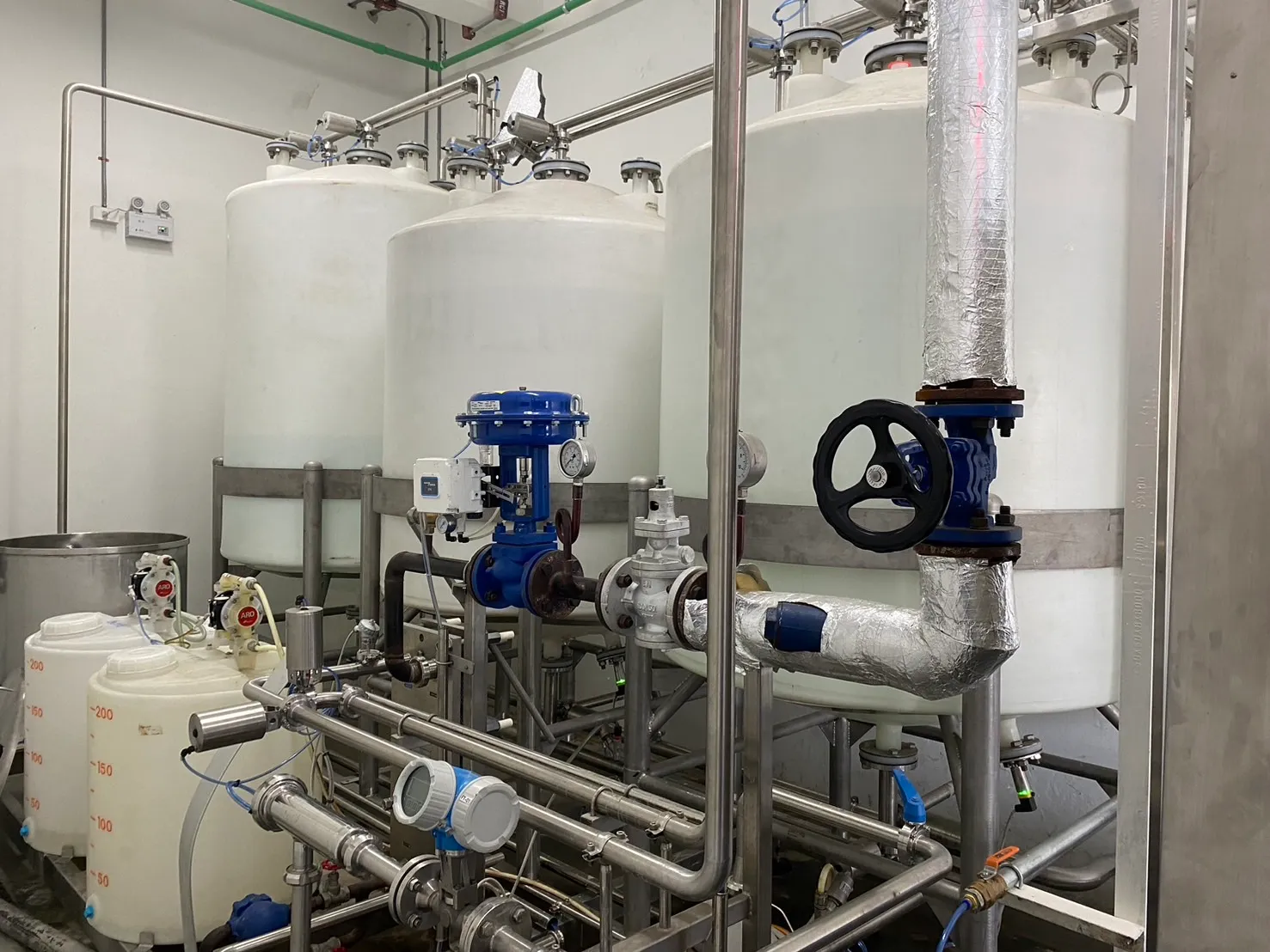 CIP Central Unit: CIP pipework, valves and vessels viewed close-up.