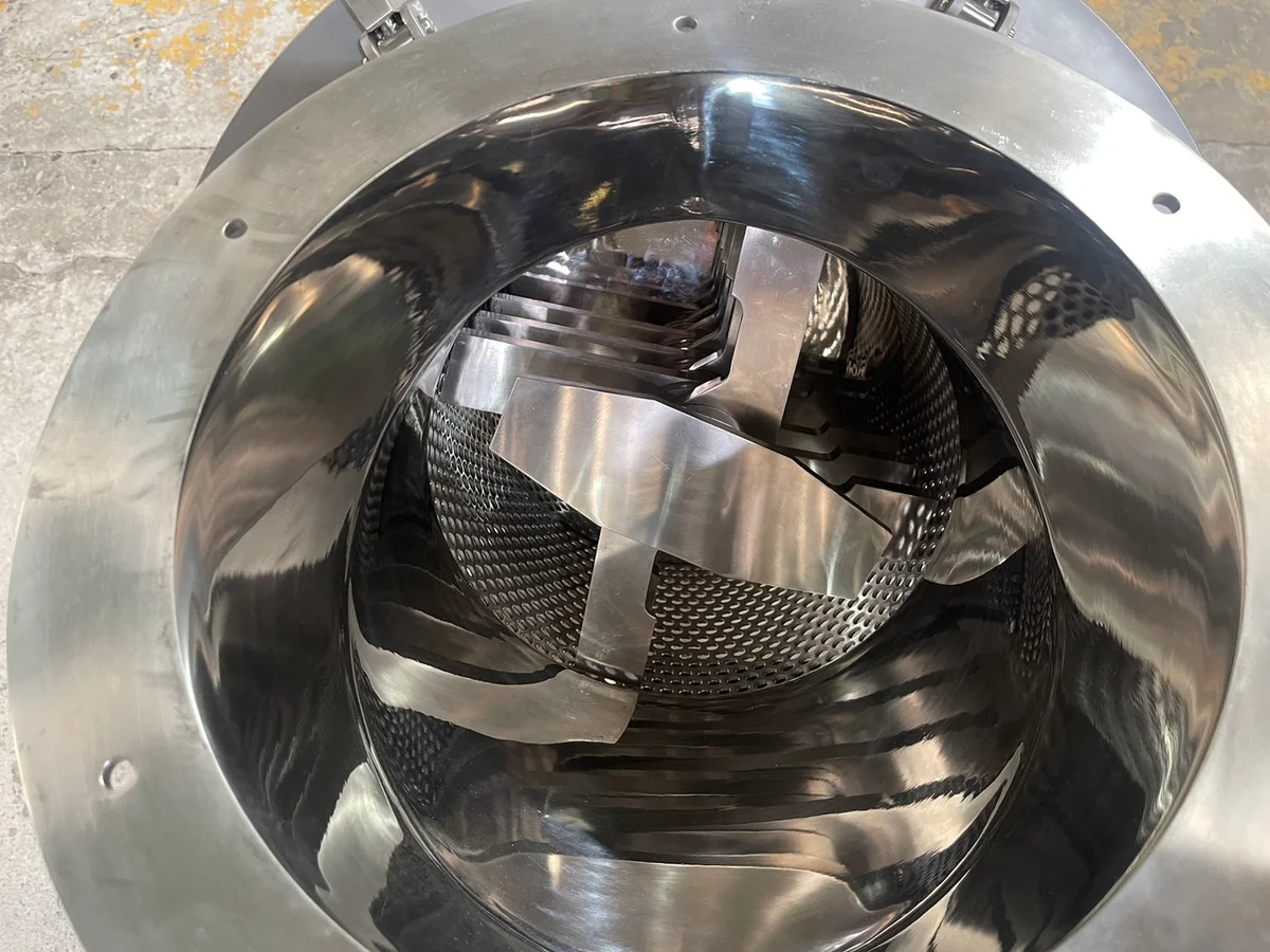 Hammer Mill: Internal rotor and perforated screen.