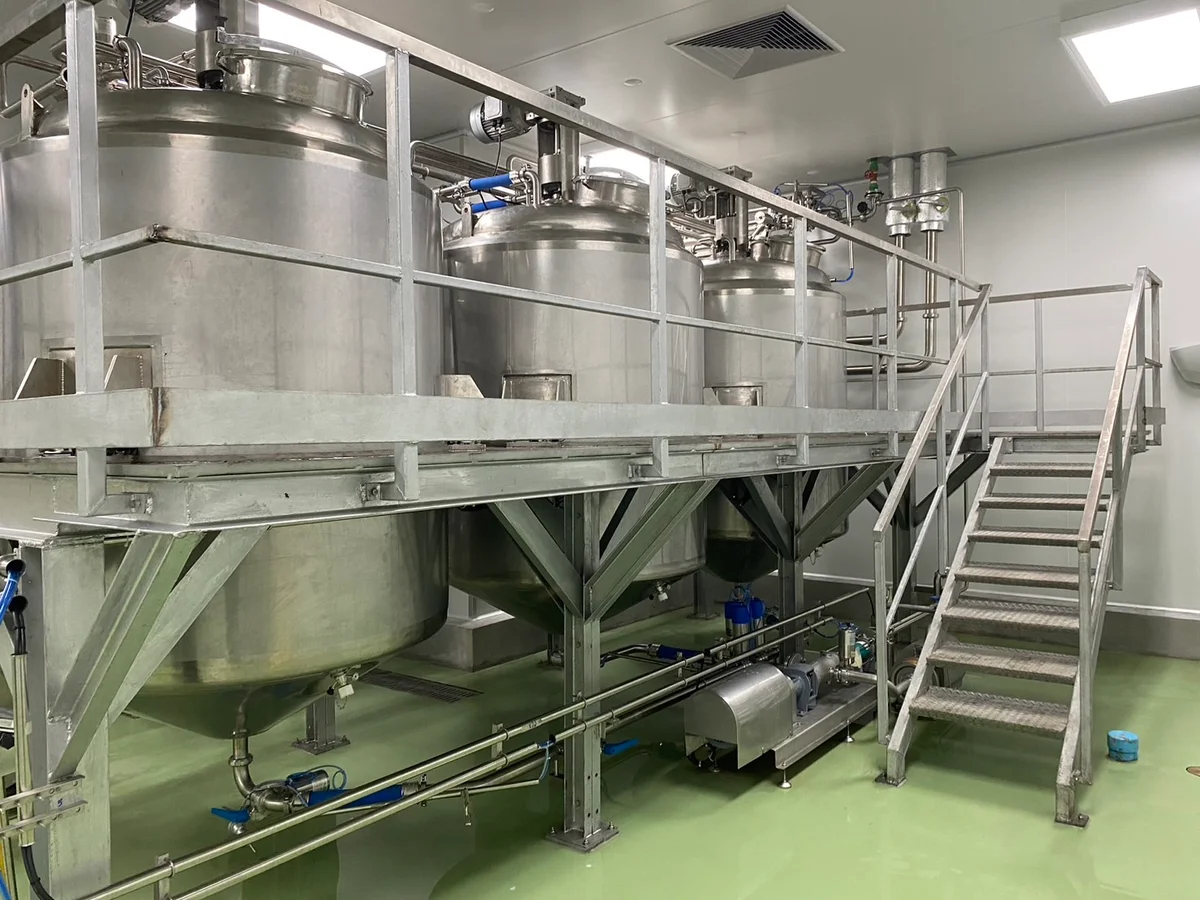 Mixing Tanks: Tank outlets and platform access.